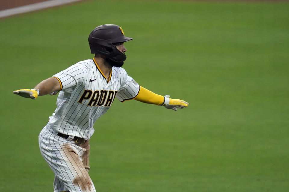 San Diego Padres' Eric Hosmer reacts after hitting a grand slam during the fifth inning of a baseball game against the Texas Rangers, Thursday, Aug. 20, 2020, in San Diego. (AP Photo/Gregory Bull)