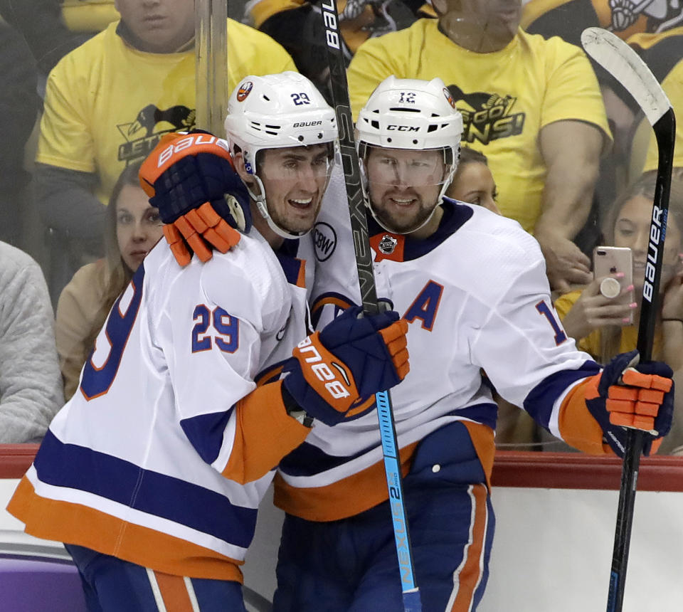 New York Islanders' Brock Nelson (29) celebrates his goal with Josh Bailey (12) during the first period in Game 4 of an NHL first-round hockey playoff series against the Pittsburgh Penguins in Pittsburgh, Tuesday, April 16, 2019. (AP Photo/Gene J. Puskar)