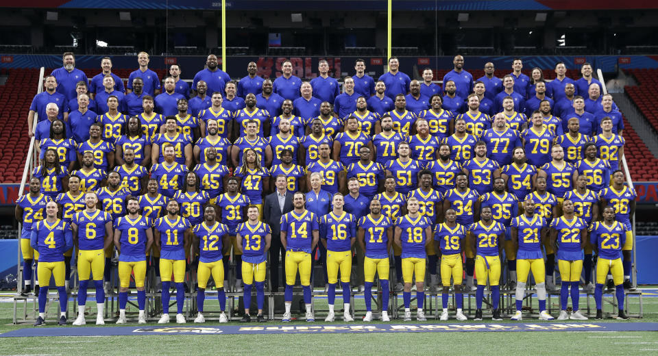 The Los Angeles Rams poses for a team photo during walkthrough at the Mercedes Benz Stadium for the NFL Super Bowl 53 football game against the New England Patriots, Saturday, Feb. 2, 2019, in Atlanta. (AP Photo/John Bazemore)