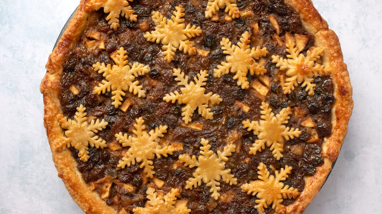 Large mince pie with snowflake pastry cutouts