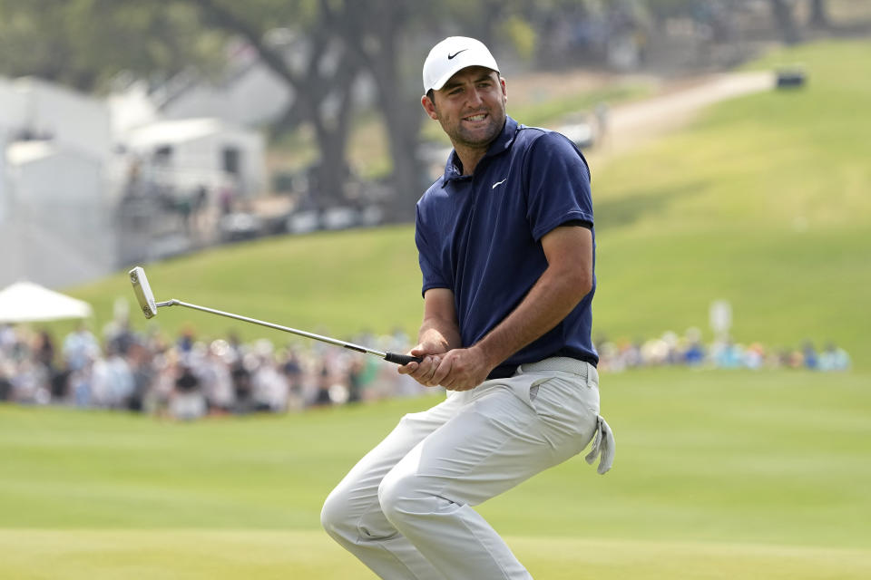 Scottie Scheffler reacts to missing a putt on a playoff hole in the semifinal round at the Dell Technologies Match Play Championship golf tournament in Austin, Texas, Sunday, March 26, 2023. Scheffler, the defending champion, lost to Sam Burns. (AP Photo/Eric Gay)