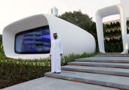 Sheikh Mohammed bin Rashid Al Maktoum, Vice-President and Prime Minister of the UAE and Ruler of Dubai, stands in front of the world's first functional 3D printed offices during the official opening in Dubai May 23, 2016. REUTERS/Ahmed Jadallah