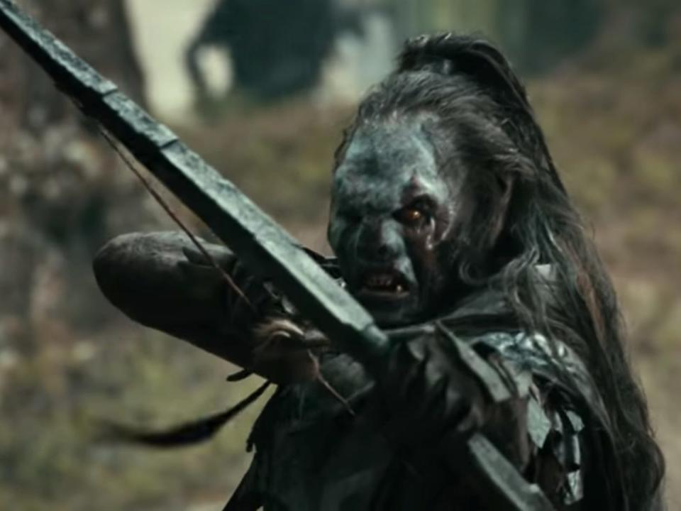 Lurtz the Uruk-hai shooting an arrow in lord of the rings