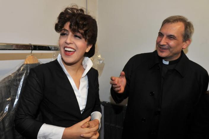 Monsignor Lucio Angel Vallejo Balda (R) stands next to Francesca Chaouqui on January 15, 2014 at the Parioli theatre (AFP Photo/Umberto Pizzi)