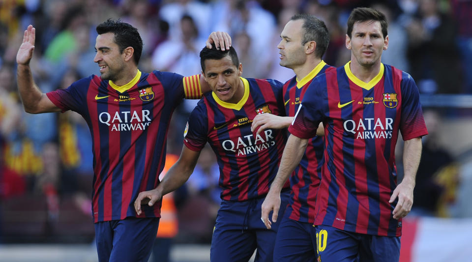 FC Barcelona's Alexis Sanchez, second left, celebrates after scoring against Getafe with his teammates Xavi Hernandez, left, Andres Iniesta, second right, and Lionel Messi from Argentina, during a Spanish La Liga soccer match at the Camp Nou stadium in Barcelona, Spain, Saturday May 3, 2014. (AP Photo/Manu Fernandez)