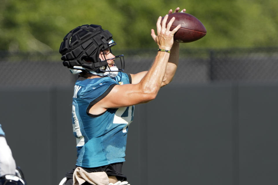 Jacksonville Jaguars tight end Josh Pederson (49) makes a reception during practice at the NFL football team’s training camp, Saturday, July 29, 2023, in Jacksonville, Fla. (AP Photo/John Raoux)
