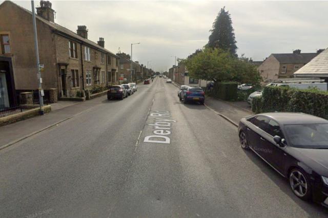 Road closed and emergency services descend after car crashes into wall