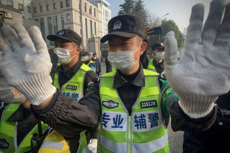 Police attempted to stop journalists from recording footage outside the Shanghai Pudong New District People's Court on Monday
