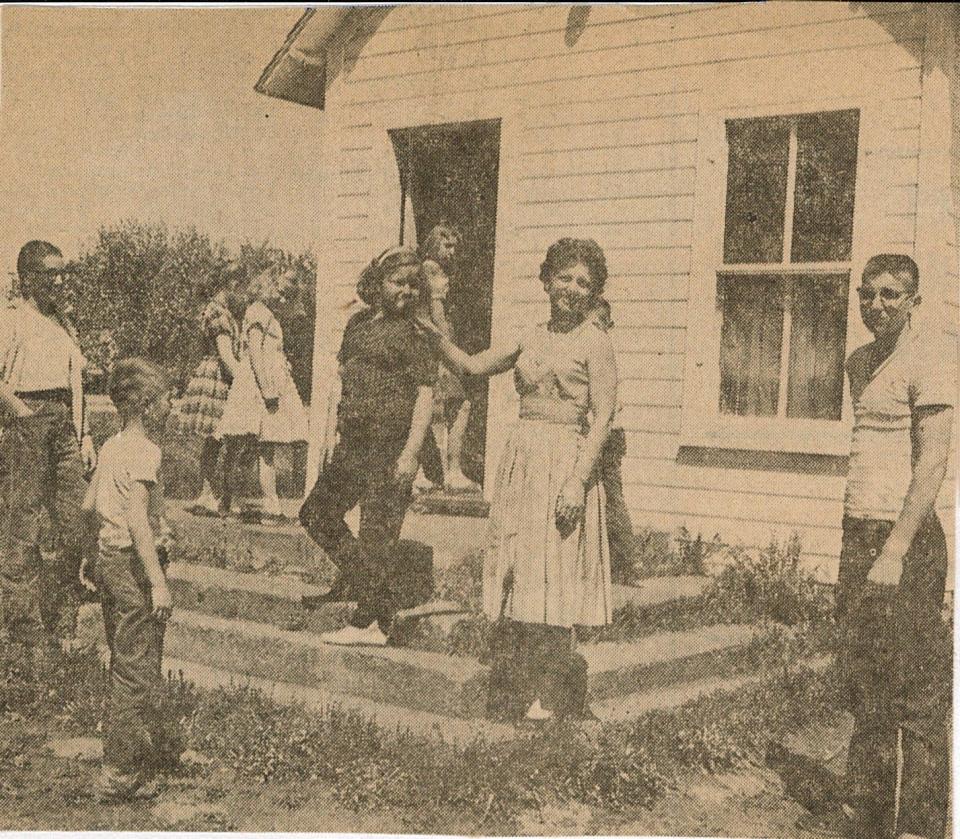 Kaye Harmann is pictured with her students outside of Alton School. It was the last country school in Dallas County, which closed in 1961.