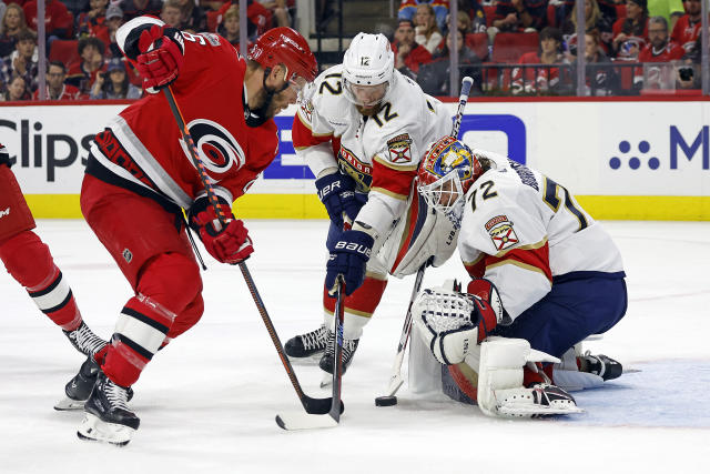 Florida Panthers goaltender Sergei Bobrovsky (72) makes the save on a shot by Carolina Hurricanes' Paul Stastny (26) as Panthers' Eric Staal (12) helps on defense during the second period of Game 2 of the NHL hockey Stanley Cup Eastern Conference finals in Raleigh, N.C., Saturday, May 20, 2023. (AP Photo/Karl B DeBlaker)