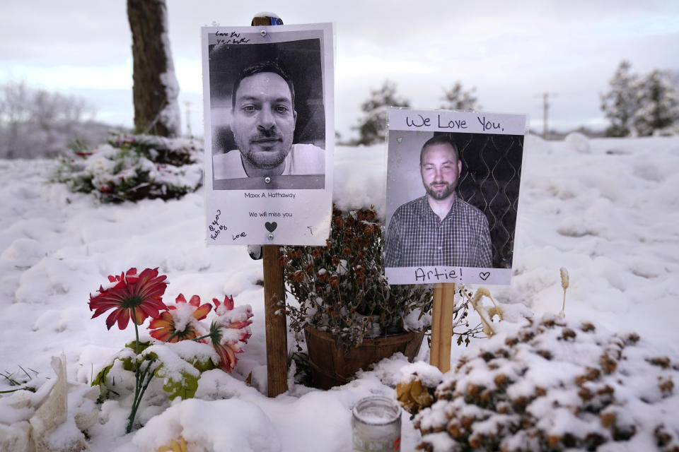 FILE - Pictures of two of the victims of the October 2023 mass shooting by Army reservist Robert Card are seen at a makeshift memorial in Lewiston, Maine, Dec. 5, 2023. Despite the warning by Card's friend and fellow Army reservist Sean Hodgson, which came alongside a series of other glaring red flags, Army officials discounted the warnings and ultimately did not stop Card from committing Maine's deadliest mass shooting when he killed multiple people in Lewiston. (AP Photo/Robert F. Bukaty, File)