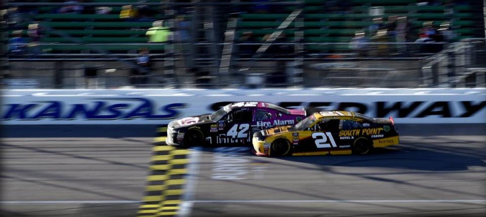 John Hunter Nemechek (No. 42 car) got past Daniel Hemric (21) with about 30 laps remaining and went on to win the Kansas Lottery 300 in 2018 at Kansas Speedway.