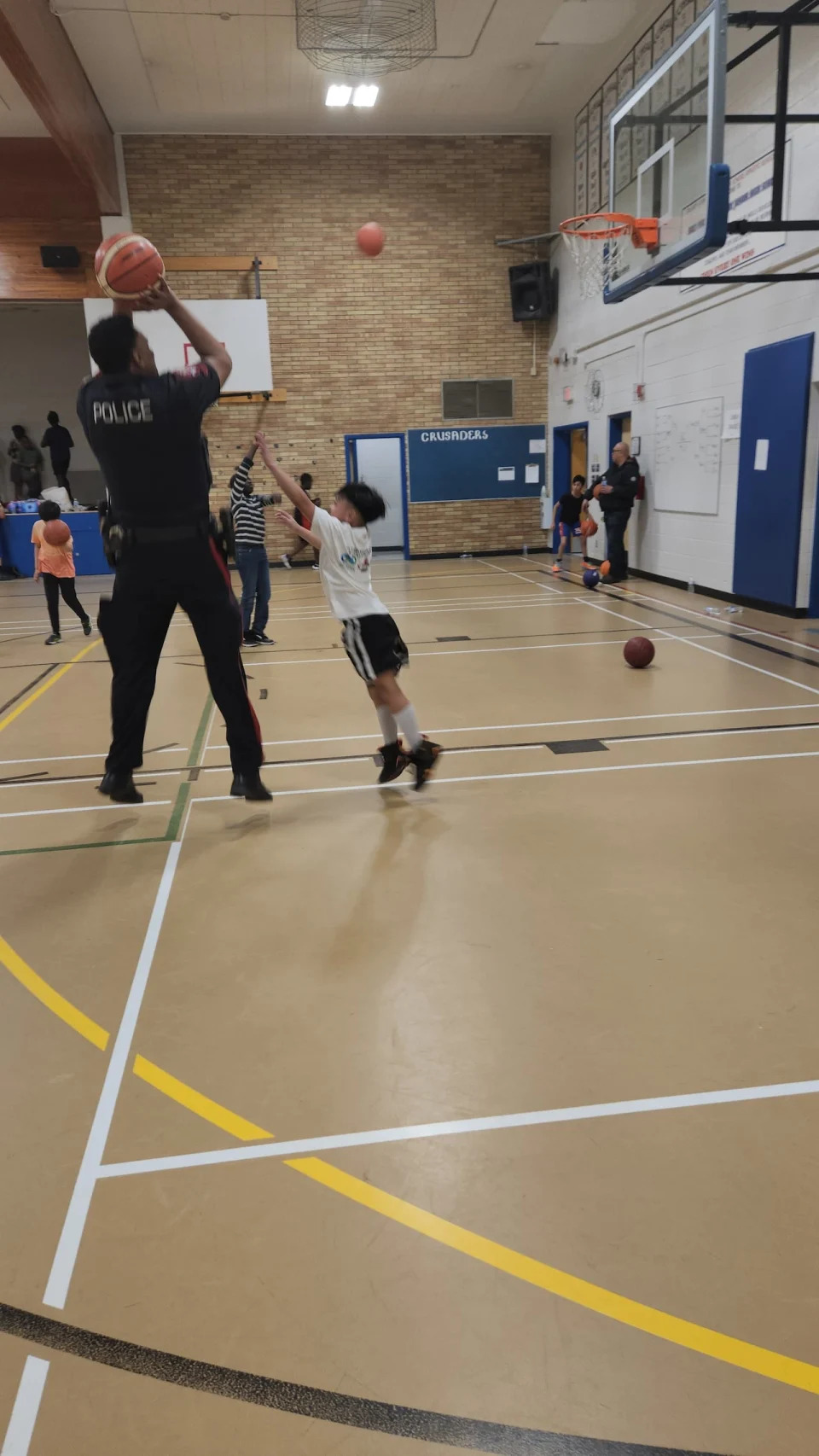 Const. Abdi Hassan at a community basketball game in March 2023. 