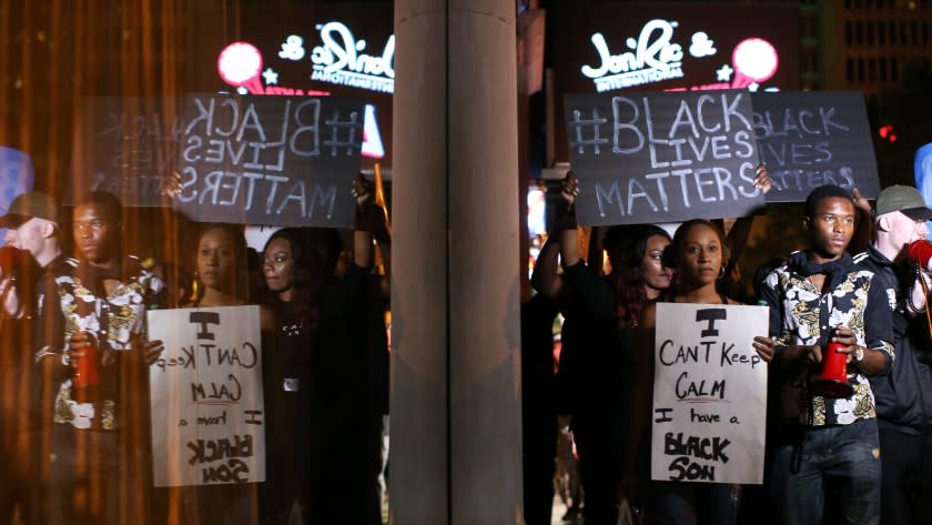 Protesters march Saturday in Atlanta in response to police shooting deaths in Tulsa, Okla., and Charlotte, N.C.