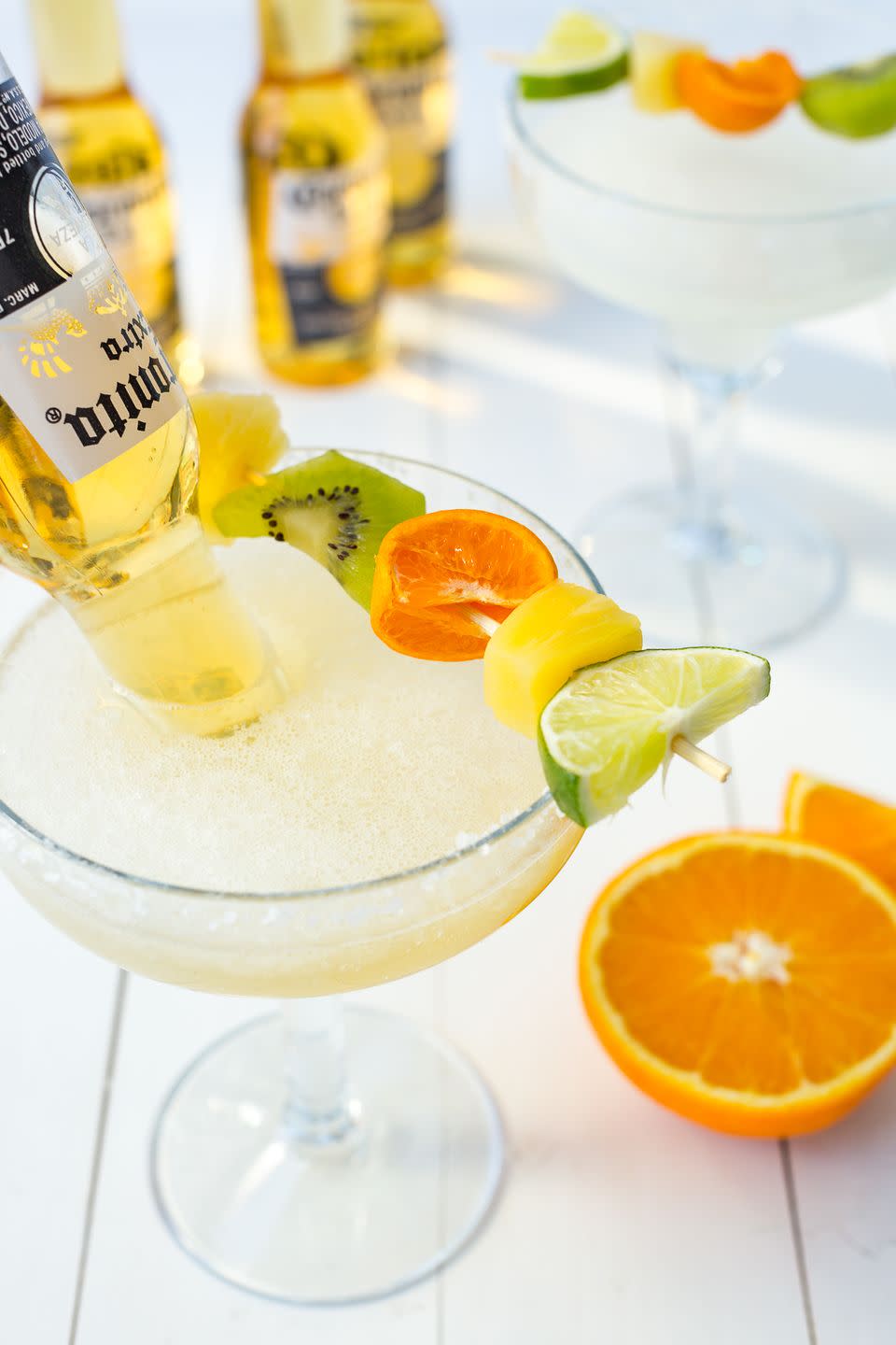 <p>We used sliced oranges, limes, kiwi and pineapple as a garnish for this fun cocktail.</p><p>Get the recipe from <a href="https://www.delish.com/cooking/recipe-ideas/recipes/a46862/bulldog-margaritas-recipe/" rel="nofollow noopener" target="_blank" data-ylk="slk:Delish;elm:context_link;itc:0;sec:content-canvas" class="link ">Delish</a>.</p>