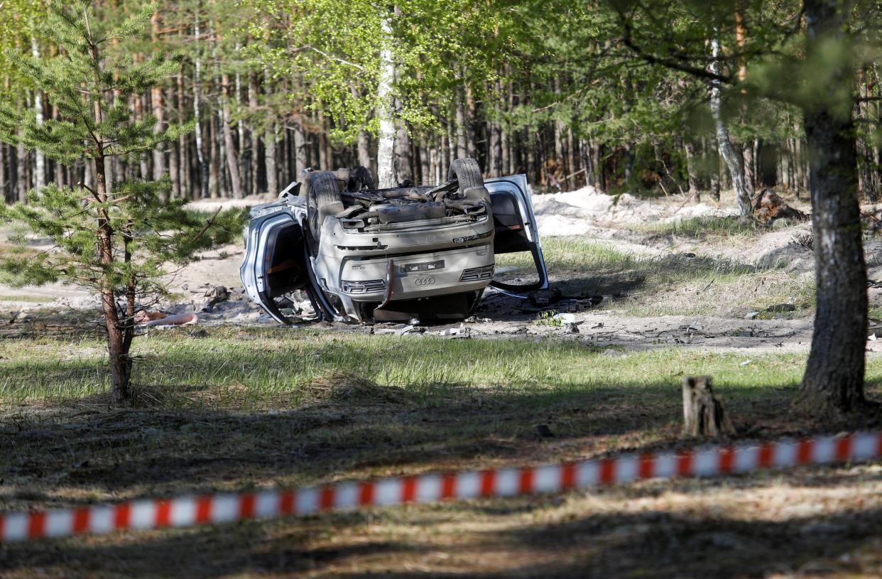 A view shows a damaged white Audi Q7 car lying overturned on a track next to a wood, after Russian nationalist writer Zakhar Prilepin was allegedly wounded in a bomb attack in a village in the Nizhny Novgorod region (REUTERS)