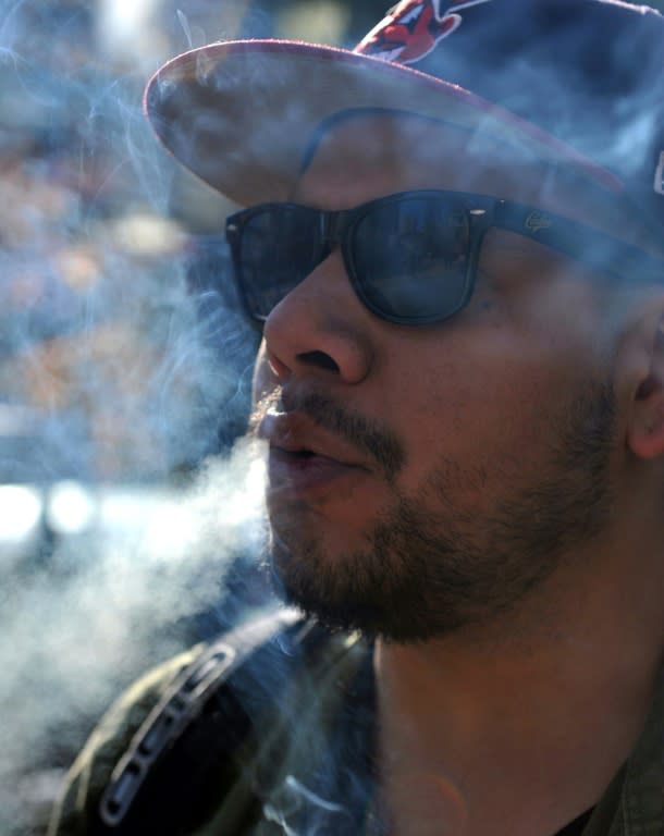 A man named Fred smokes marijuana in Vancouver, Canada, where Prime Minister Justin Trudeau has defended legalization as intended to protect young people and to shut down drug dealers