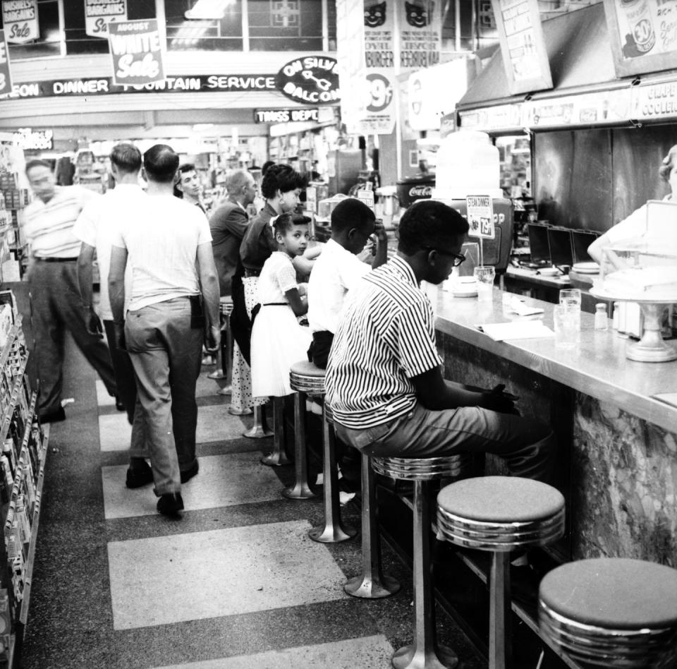 <p>Due to segregation and Jim Crow laws, it was illegal for Black people to sit at the counters in many shops until 1964. Here, a sit-in takes place in Oklahoma City on August 26, 1958 to desegregate lunch counters. Many similar protests took place during the <a href="https://www.history.com/topics/black-history/civil-rights-movement" rel="nofollow noopener" target="_blank" data-ylk="slk:Civil Rights Movement;elm:context_link;itc:0;sec:content-canvas" class="link ">Civil Rights Movement</a>.</p>