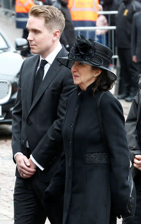 Jane Hawking and her son Timothy follow the coffin into Great St Marys Church, where the funeral of theoretical physicist Prof Stephen Hawking is being held, in Cambridge, Britain, March 31, 2018. REUTERS/Henry Nicholls