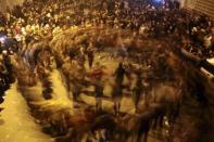 People dance as they celebrate in Kurdish-dominated Diyarbakir in southeastern Turkey, after Kurdish forces took full control of the Syrian town of Kobani, January 26, 2015. Kurdish forces took full control of Kobani on Monday, driving out remaining Islamic State fighters to end a four-month battle that became a focal point of the international fight against the ultra-hardline Islamist group. REUTERS/Sertac Kayar