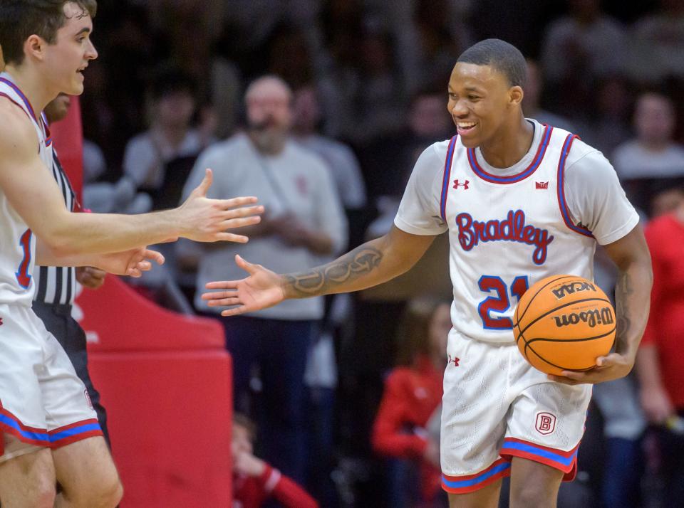 Bradley's Duke Deen (21) is all smiles as he celebrates a turnover by Illinois State with teammate Connor Hickman in the second half Wednesday, Jan. 25, 2023 at Carver Arena. The Braves downed the Redbirds 79-75 in overtime.