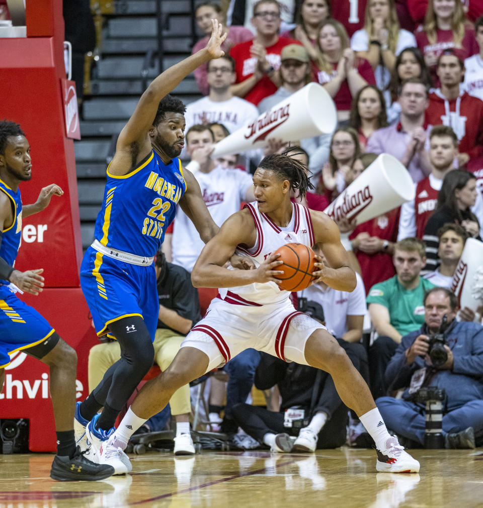 Morehead State forward LJ Bryan (22) defends Indiana forward Malik Reneau (5) as he drives toward the basket during the first half of an NCAA college basketball game, Monday, Nov. 7, 2022, in Bloomington, Ind. (AP Photo/Doug McSchooler)