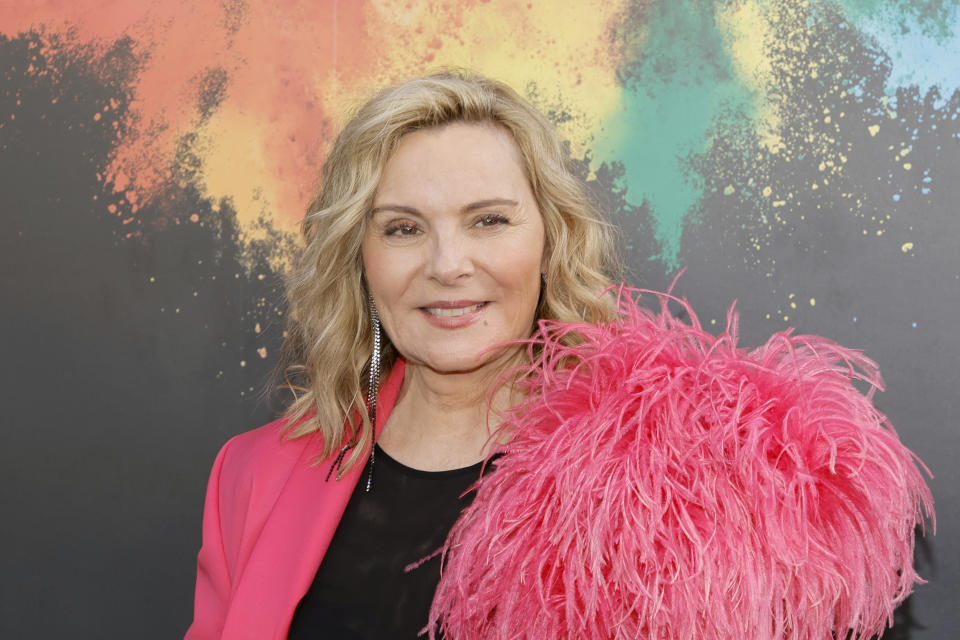 Actress Kim Cattrall, 65, shared a shot of herself in a brown swimsuit.  (Photo: Kevin Winter/Getty Images)