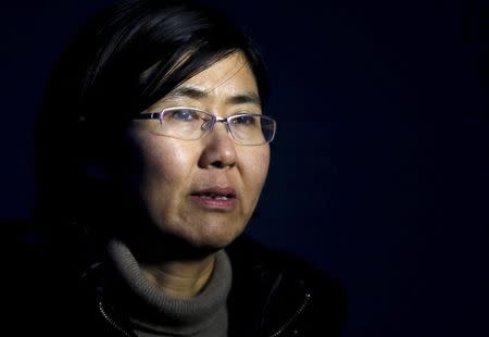 Human rights lawyer Wang Yu talks during an interview with Reuters in Beijing in this March 1, 2014 file photo. REUTERS/Kim Kyung-Hoon/Files