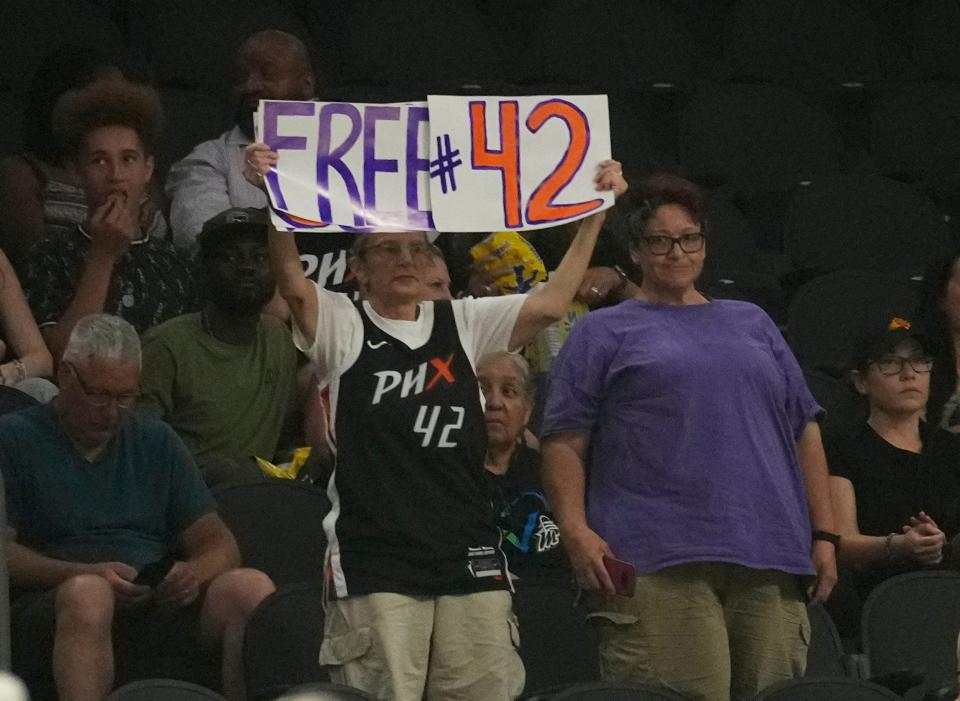 Jun 27, 2022; Phoenix, Ariz., U.S.;  A Phoenix Mercury fan holds a sign in support of center Brittney Griner during the third quarter against the Indiana Fever at Footprint Center. Griner has been detained in Russia on a drug charge since February.