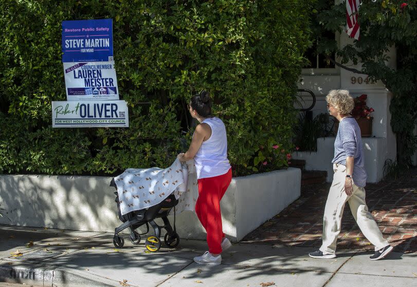 WEST HOLLYWOOD, CA-OCTOBER 26, 2022: Signs with the name of a candidate for the West Hollywood City Council are placed in front of a home on Elevado Ave. in West Hollywood. The contentious election for three seats on the West Hollywood City Council has become a contest between traditional liberals and so-called "woke" people who pushed to cut the number of sheriff's deputies. (Mel Melcon / Los Angeles Times)