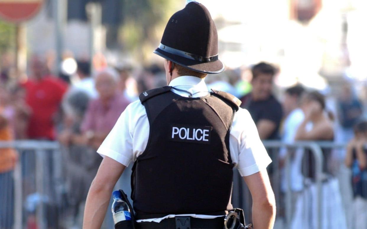 Police Officer on foot patrol in England. - www.alamy.com