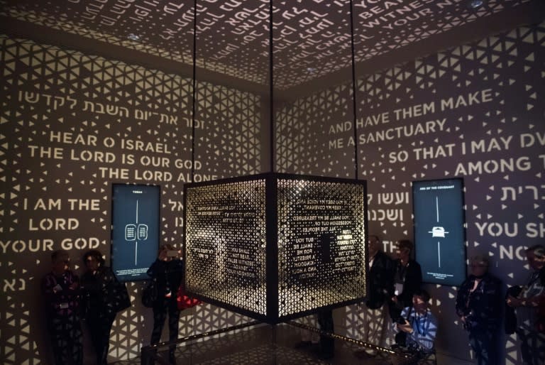 Visitors walk through the Ark of the Covenant section of the "Journey through the Hebrew Bible" exhibit at the new Museum of the Bible