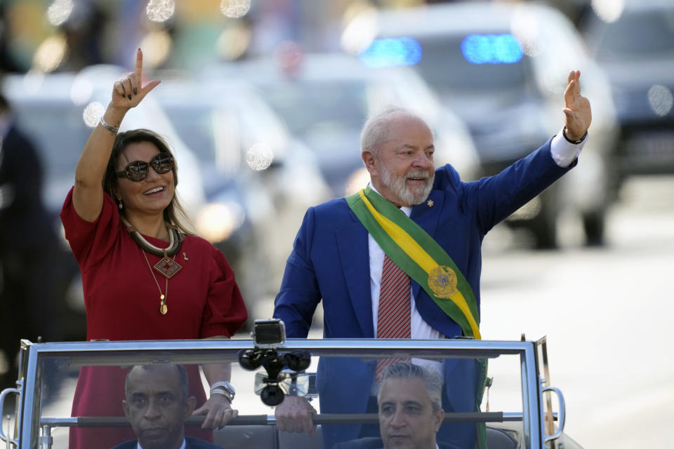 Brazilian President Luiz Inacio Lula da Silva and first lady Rosangela da Silva wave at the start of the military parade on Independence Day in Brasilia, Brazil, Thursday, Sept. 7, 2023. (AP Photo/Eraldo Peres)