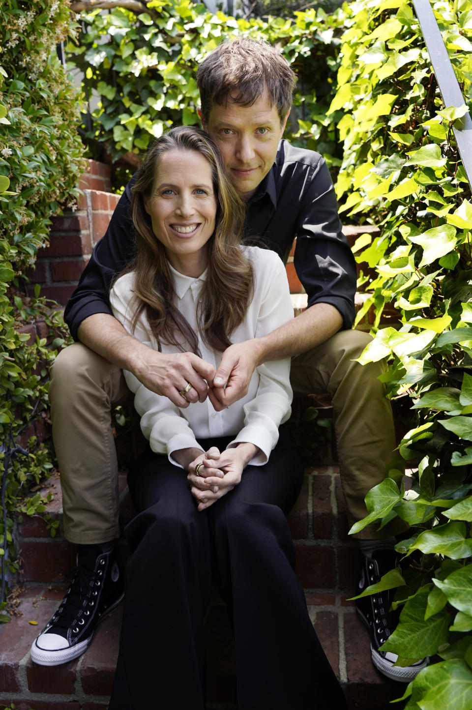 Kristin Gore, foreground, and her husband Damian Kulash, co-directors of the film "The Beanie Bubble," pose for a portrait in Los Angeles on June 28, 2023. (AP Photo/Chris Pizzello)