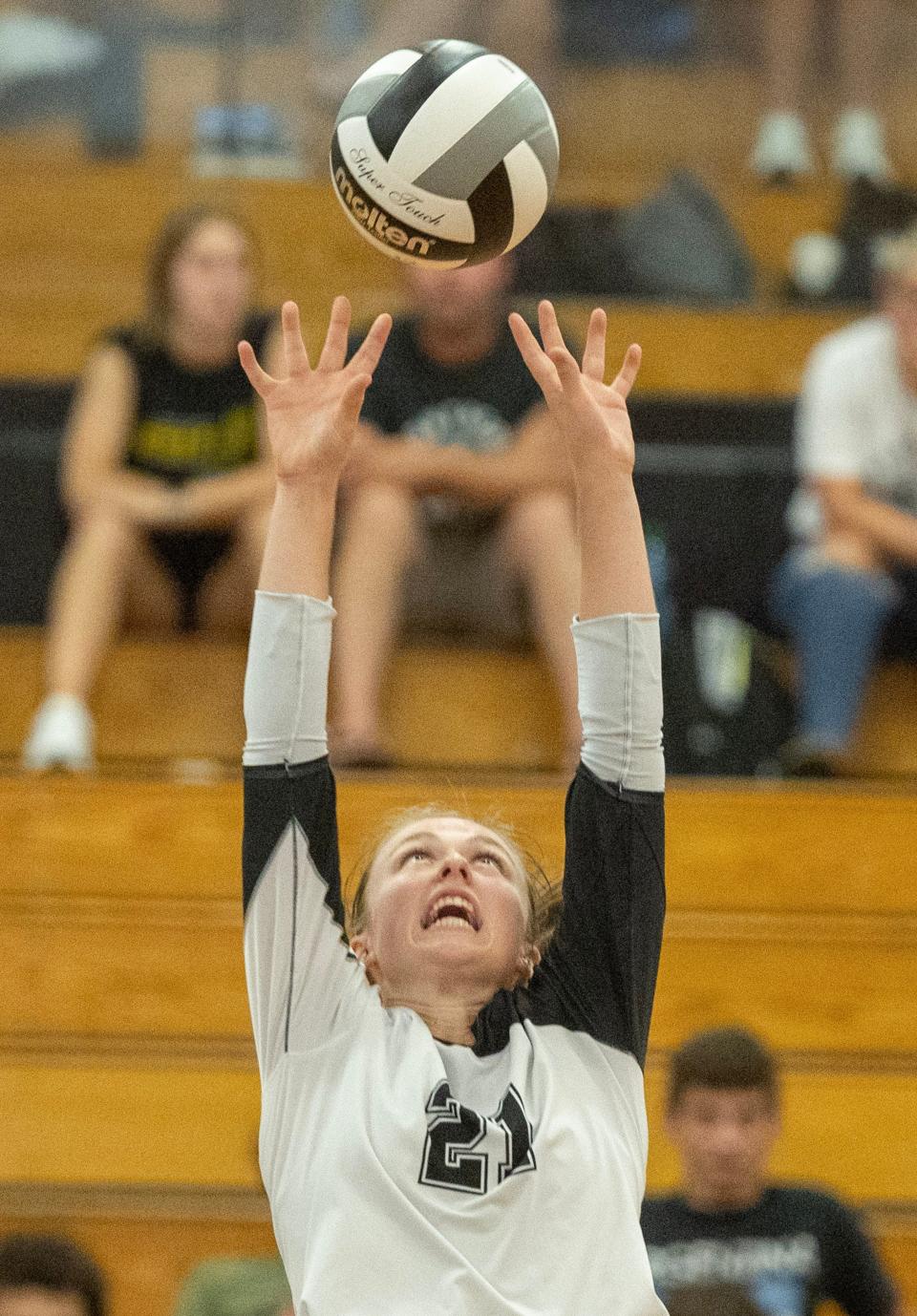 Perry's Sarah Mohr sets the ball against GlenOak Thursday, September 7, 2023.