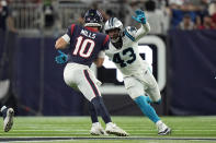 Houston Texans quarterback Davis Mills (10) is pressured by Carolina Panthers linebacker Haason Reddick (43) during the second half of an NFL football game Thursday, Sept. 23, 2021, in Houston. (AP Photo/Eric Christian Smith)