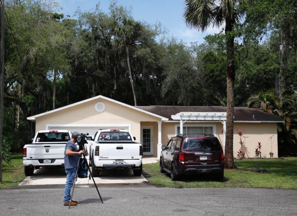 A TV camerman films outside of Joseph Biggs' home in Ormond Beach. On Monday, a federal judge ordered that the Proud Boys leader to be locked up as he awaits trial in the Jan. 6 attack on the U.S. Capitol building.