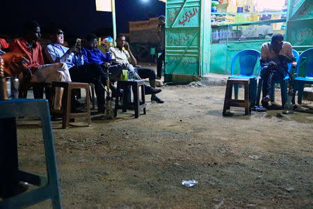 People smoke a shisha in Nyala market, during Sudanese President Omar al-Bashir visit to the war-torn Darfur region, in Nyala, Darfur, Sudan September 19, 2017. REUTERS/Mohamed Nureldin Abdallah