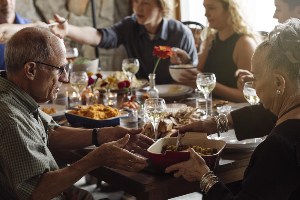 Enjoying a Thanksgiving dinner. (Getty Images)