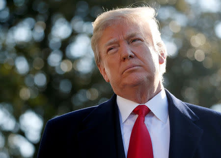 FILE PHOTO: U.S. President Donald Trump speaks with the news media before boarding Marine One helicopter to depart for travel to California via Joint Base Andrews from the South Lawn of the White House in Washington, U.S., March 13, 2018. REUTERS/Leah Millis/File Photo