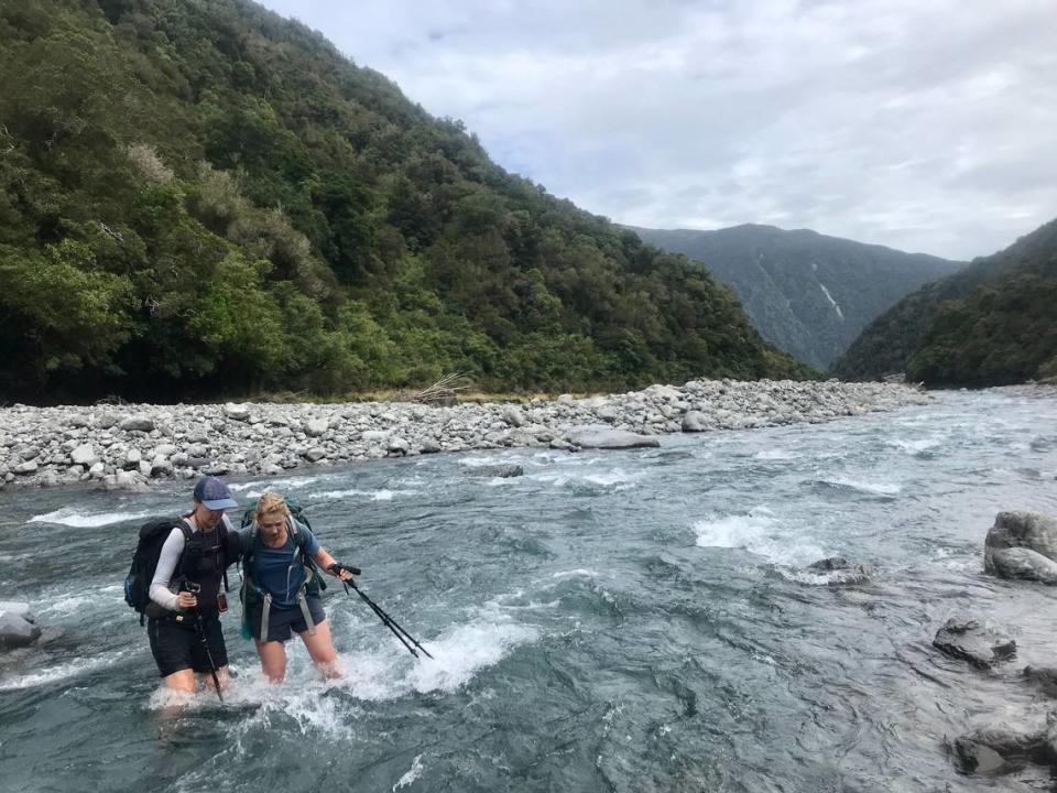 Ashley Ludack, left, and Claire Lewinski cross the Deception River in New Zealand during their thru-hike of the Te Araroa trail. Lewinski, an Idaho native, hiked the trail as part of her recovery from a traumatic brain injury.