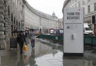 A large sign to thank people for coming to London's West End and to stay safe by observing social distancing to help stop the spread of the coronavirus in London, Thursday, Oct. 29, 2020. Around 100,000 people are catching the coronavirus every day in England, according to the latest Imperial College London study. (AP Photo/Alastair Grant)