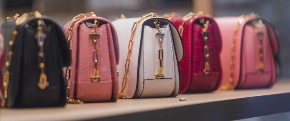 Woman purses in a store in Paris.