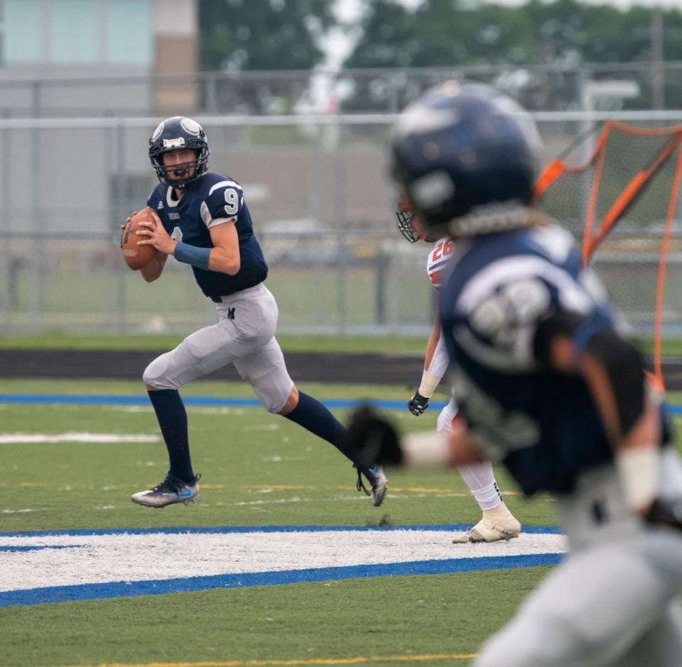 Marysville’s Noah LaValley looks for a receiver during a game last month. The Vikings will visit St. Clair Shores South Lake on Friday night.