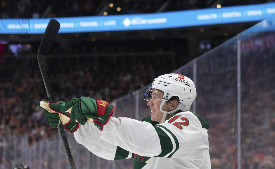 Minnesota Wild's Matt Boldy (12) celebrates a goal against the Edmonton Oilers during the third period of an NHL hockey game Friday, Feb. 23, 2024, in Edmonton, Alberta. (Jason Franson/The Canadian Press via AP)