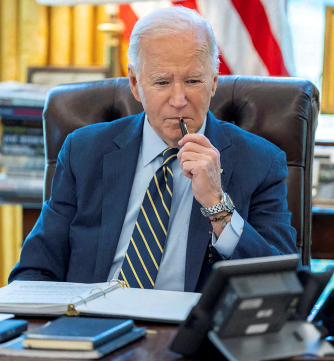 FILE PHOTO: U.S. President Joe Biden speaks on the phone with Israeli Prime Minister Benjamin Netanyahu in this White House handout image taken in the Oval Office in Washington, U.S., April 4, 2024. The White House/Handout via REUTERS THIS IMAGE HAS BEEN SUPPLIED BY A THIRD PARTY/File Photo