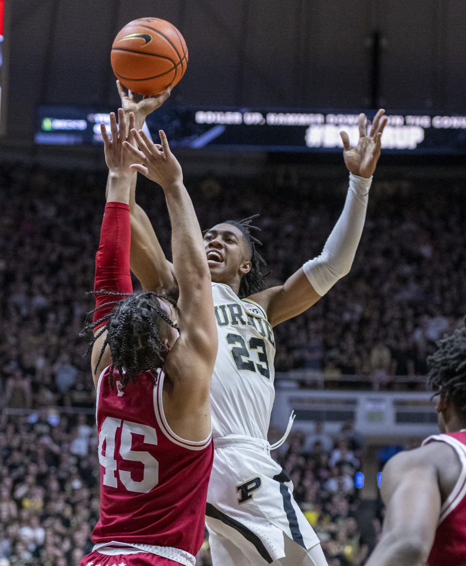 Purdue guard Jaden Ivey (23) shoots over the defense of Indiana guard Parker Stewart (45) during the second half of an NCAA college basketball game, Saturday, March 5, 2022, in West Lafayette, Ind. (AP Photo/Doug McSchooler)