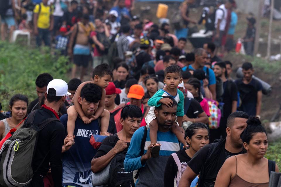 Migrants arrive to Bajo Chiquito village, the first border control of the Darien Province in Panama, on September 22, 2023.  / Credit: LUIS ACOSTA/AFP via Getty Images