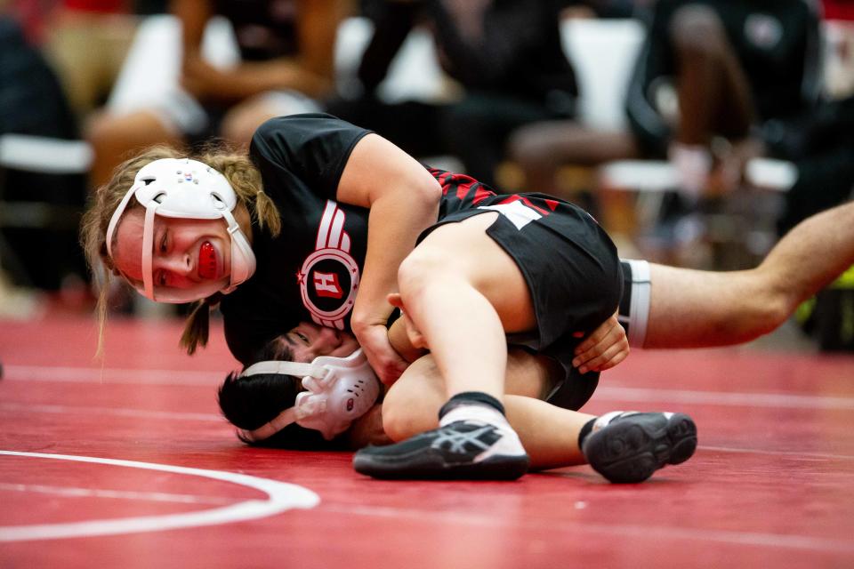 Holland's Kaydence Vesper takes on Isaac Garcia during the Tim Horn Wrestling Tournament Saturday, Jan. 14, 2023, at Holland High School. 