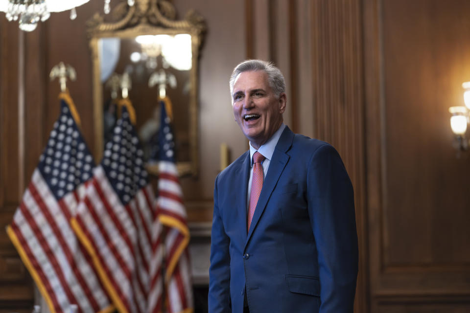 Rep. Kevin McCarthy, R-Calif., smiles as he holds a photo line to say farewell to staff and lawmakers on his last day in Congress, at the Capitol in Washington, Thursday, Dec. 14, 2023. McCarthy was ousted as House speaker in October by his hard-right detractors, including some of Donald Trump's most loyal allies among the House GOP. (AP Photo/J. Scott Applewhite)